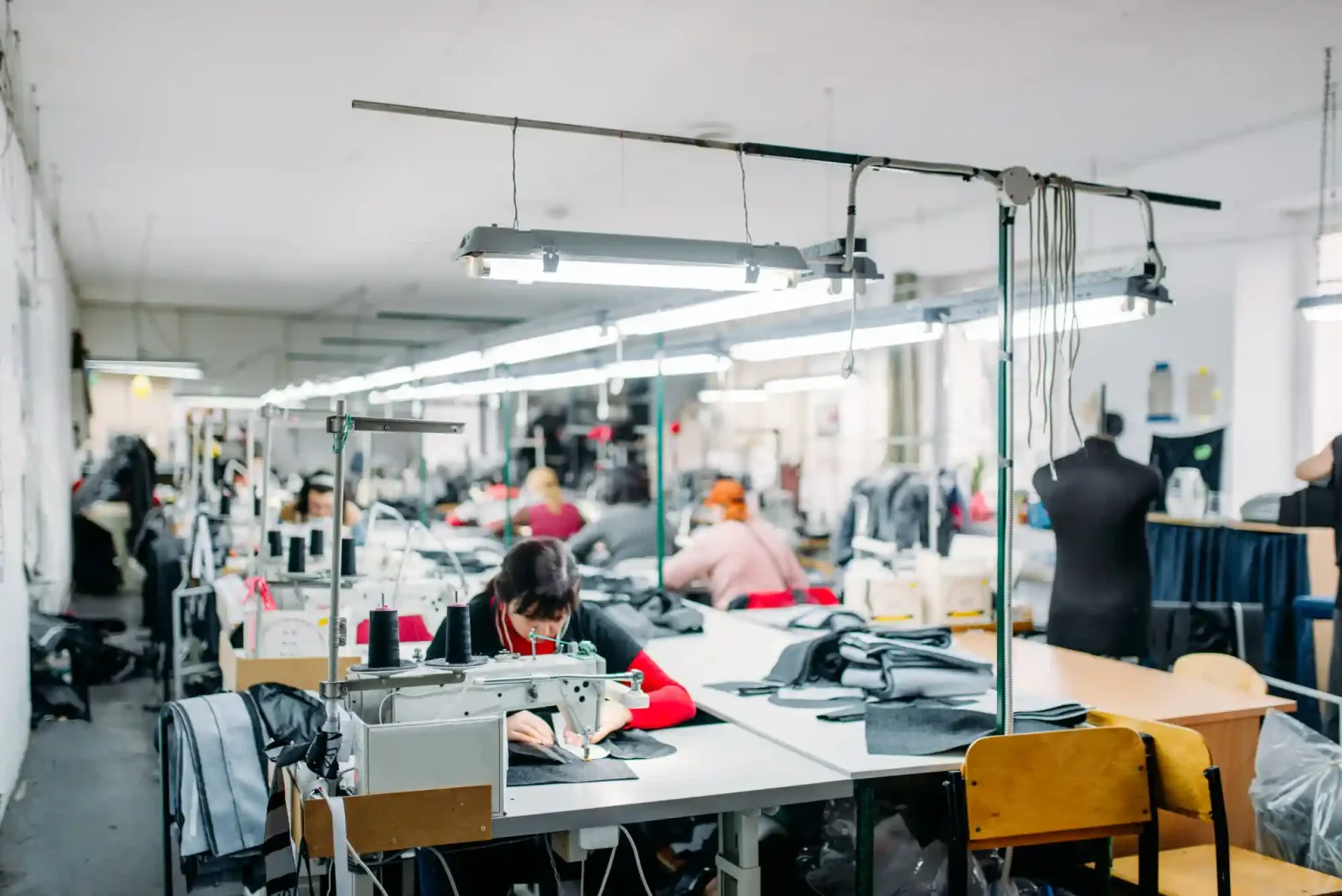 Factory working sewing uniforms