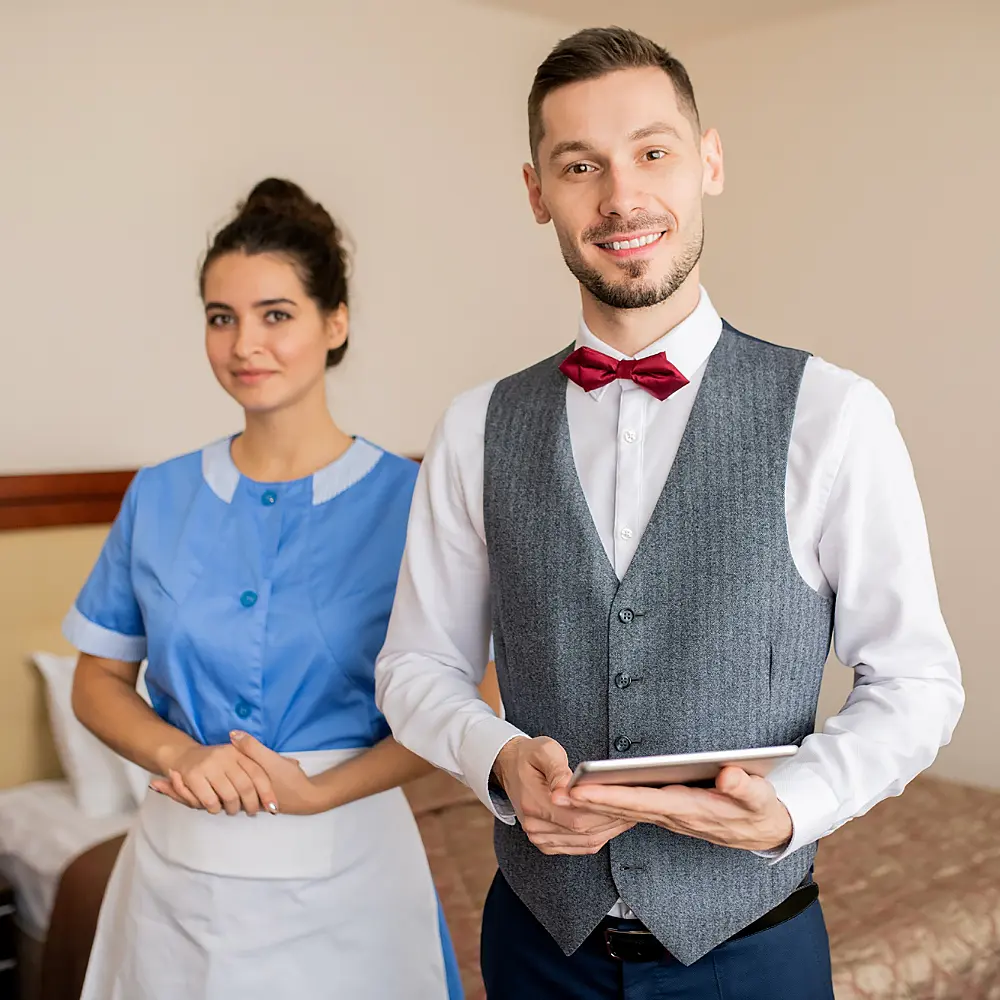 staff wearing housekeeping uniform by studio unfiorms