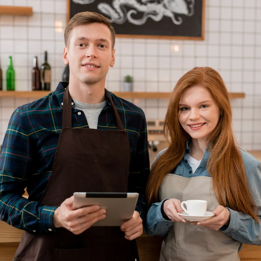 employee wearing restaurant uniform from studio uniforms
